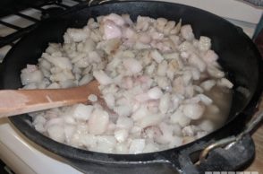 lard being rendered in a pan